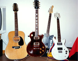 Some of my older axes, a Takamine 12 and an Aria Pro II for instance