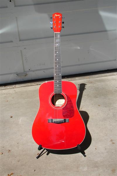 Squier acoustic, that sounds really good.  And it holds it's tuning really well also.  Paid $75, came with hard case, stand and beginner's book.