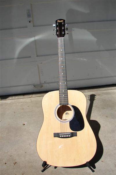 Was my son's, but we traded and he got the Strat.  I use this one for open tunings.  Paid $130.