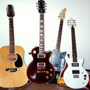 Some of my older axes, a Takamine 12 and an Aria Pro II for instance