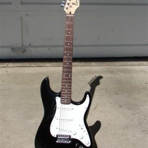 Squier Strat made in Indonesia. My 13-year-old son now has this one. Paid $110
